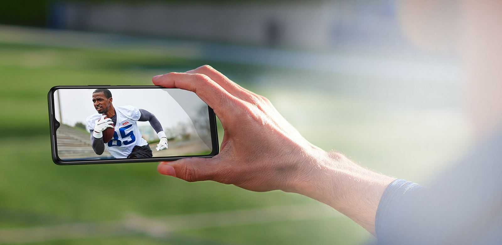 phone featuring football game